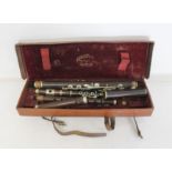 Antique rosewood Hawkes & Son part flute in leather travel case. Also included is an antique