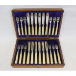 Set of twelve engraved fish knives and twelve forks, Sheffield 1909, in oak case