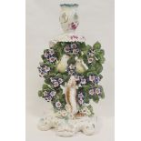 18th century Derby porcelain candlestick with a pair of birds perched in bocage with begging dog