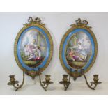 Pair of 19th century French girandoles with Sevres style hand painted polychrome central oval