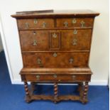 Late 17th century inlaid walnut chest on stand, the upper section fitted with four drawers, the