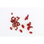 Single strand necklace of graduated cherry red amber beads, the largest bead approximately 3cm long