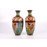 Pair of Japanese cloisonne vases, the yellow flecked green ground decoration with shield shaped