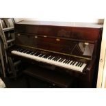 Contemporary Steinhoff mahogany cased upright cottage type piano with matching piano stool