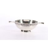 Contemporary silver Scottish quaich having Celtic dragon knot rim by Hamilton and Inches,