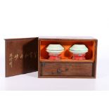 Early 20th century Chinese seal box with ceramic wax dishes and three soapstone chops, the wooden
