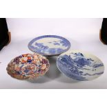 Large Japanese blue and white transfer printed dish, depicting cranes above Fuji, 45 cm, another