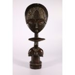 Large Ashanti Akuaba fertility doll, the stand carved with twin female supports, the face with