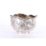 French 18th century style silver white metal bowl decorated in repousse with musical instruments,