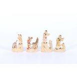 Set of four Chinese bone carvings depicting children and dancing animals, 5-7cm with inked detail (