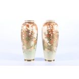 Pair of early 20th Century Satsuma vases decorated with birds and flowers, signed to the base, 15cm.