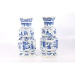 Pair of 19th century blue and white vases of octagonal section with lobed flaring rim, waisted