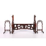 Chinese hardwood screen support with pierced and carved key fret frieze and two small pierced and