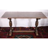 Oak plank top refectory style dining table raised on turned supports united by understretcher, 152cm