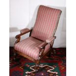 19th century mahogany framed armchair upholstered in tartan material, having scrolls arms, raised on