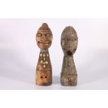 Two carved busts of figures male and female with inlaid shell decoration, one with inset hair to the