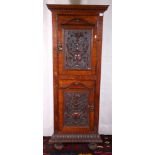 Late Victorian oak floor standing corner cabinet having dental work cornice above two shield