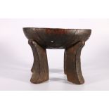 Ethiopian ironwood Jima stool with dished top, on four carved supports, possibly early 20th Century,