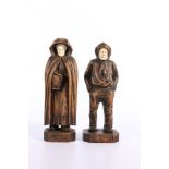 Pair of German Black Forest carved treen figures of a sailor and fish wife with boar ivory faces,