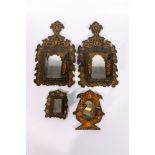 A pair of Iranian, early 20th century wooden mirror frames, lacquered and decorated with figures and
