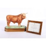 Royal Worcester porcelain model of a Highland Bull modelled by Doris Lindner on wooden plinth base