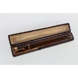 Unhallmarked yellow metal mounted amber diamond set cheroot holder in fitted case marked Severin