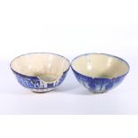 Two 18th or 19th century Iranian blue and white deep bowls, thickly glazed and decorated with