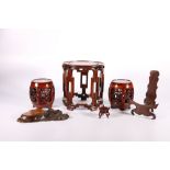 Pair of 20th Century barrel seat hardwood stands and a larger raised circular stand, a plate