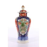 Japanese Imari vase and cover the high shouldered body decorated with Kylin and flower panels, 26 cm