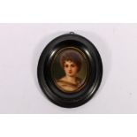 Continental painted porcelain oval plaque depicting a portrait of a young male in the manner of