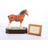 Royal Worcester porcelain model of a Cyldesdale Stallion modelled by Doris Lindner on wooden