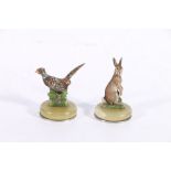 Pair of Art Deco cold painted bronze table place holders modelled as pheasant and hare on circular