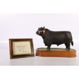 Royal Worcester porcelain model of a Aberdeen Angus Bull modelled by Doris Lindner on wooden