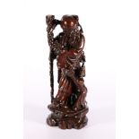 Chinese early 20th Century carved hardwood figure of Shou Lao with child by his side, 39 cm.