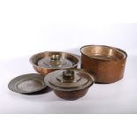 Group of 19th century Jordanian copper cooking dishes including three graduated pots and covers, one