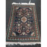 Eastern blue ground fringed rug with Kishan Process Hamburg label, 210cm x 142cm