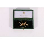 Unhallmarked yellow metal lizard brooch, 4.5cm long, 7.1g gross in Asprey and Garrard of London box