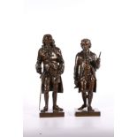 Pair of bronze statues of gentleman in late 18th or early 19th century dress, raised on square