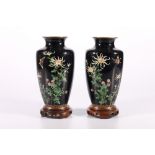 Pair of early 20th Century high shouldered cloisonne vases, the dark blue ground decorated with a