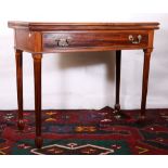 19th century flame mahogany fold over tea table raised on fluted supports terminating in pumpkin