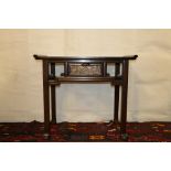 Chinese early 20th century side table, the rectangular top with up swept edges to the sides, single