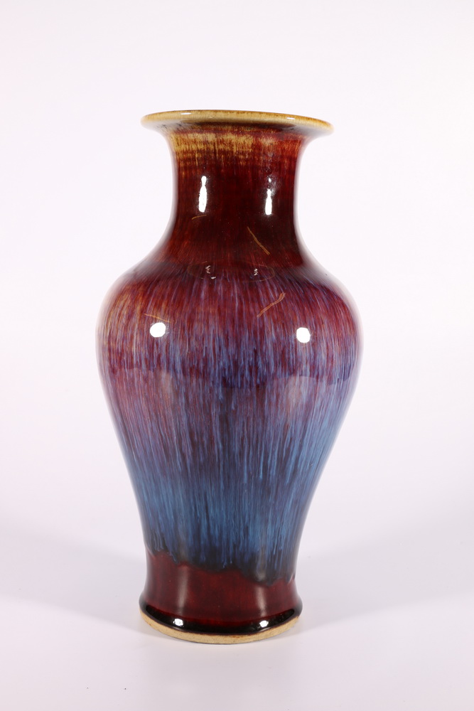 20th Century Chinese vase decorated with a glossy sang de boeuf glaze, the high shouldered vase with