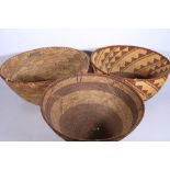 African deep coiled bowl with spiralling triangular decoration and another deep bowl with coloured
