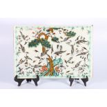Late 19th Century Chinese famille rose tile decorated with multiple cranes surrounding an old pine