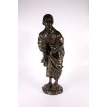 Large Japanese bronze figure of an elderly washer woman in traditional dress holding a cloth,