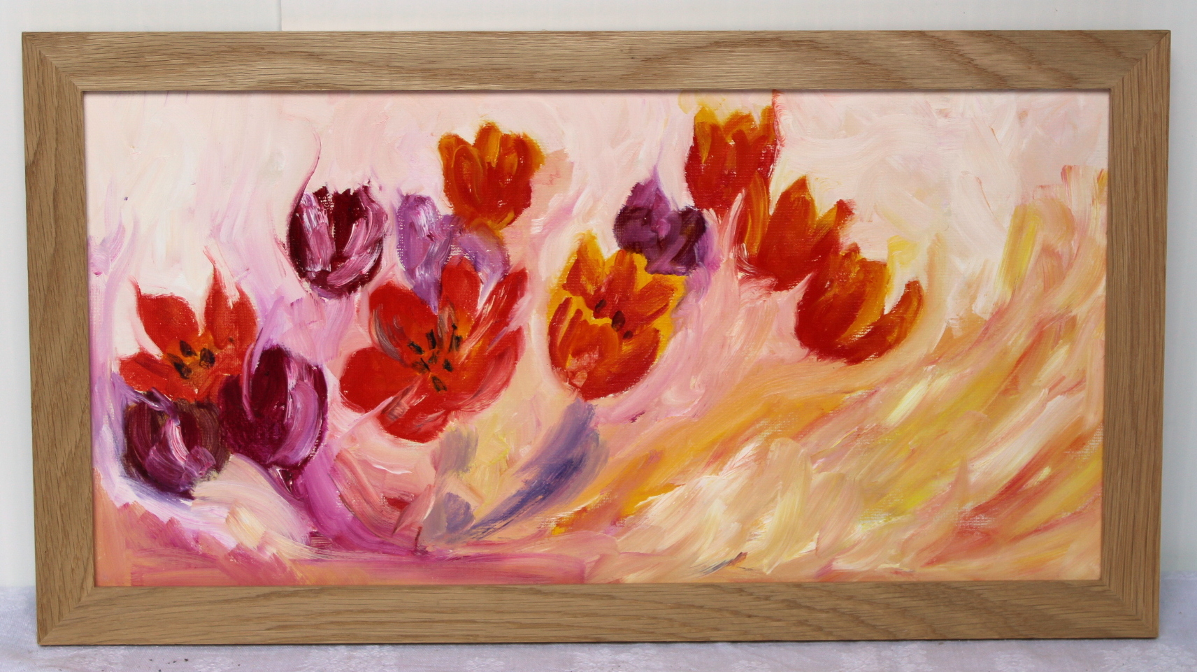 FOLLOWER OF WINIFRED NICHOLSON.Tulips.Oil on board.24cm x 49cm.