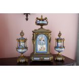 Late 19th century French gilt metal three piece clock garniture, the clock with urn finial and "