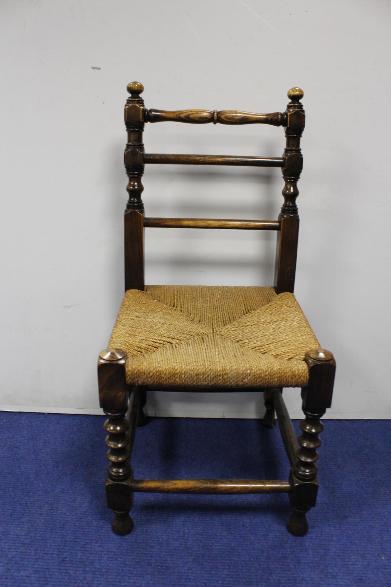 Antique elm bobbin turned child's chair, with rushwork seat