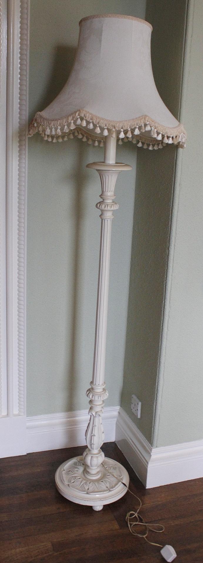 White painted standard lamp of foliate reeded baluster form (electrical rewiring required).