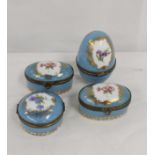 Four Continental porcelain boxes of various forms with floral decoration and turquoise grounds in